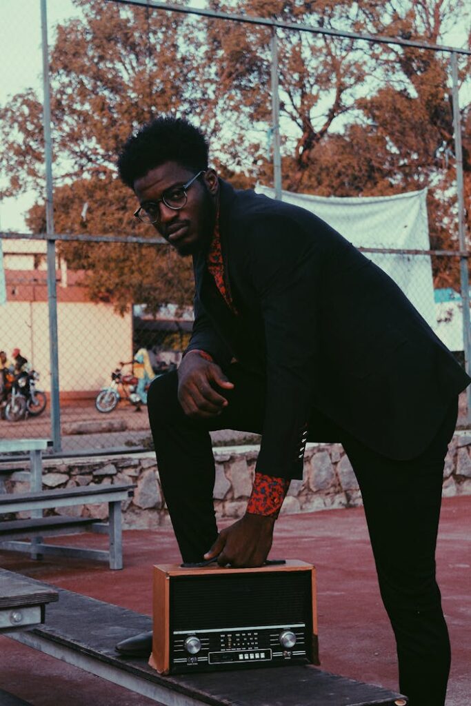 Photo Of Man Holding Radio